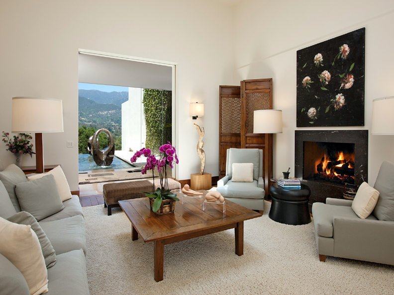 356 Woodley Road Montecito, CA 93108 - Photo 5 of 17 a living room with furniture flower pot and a fireplace