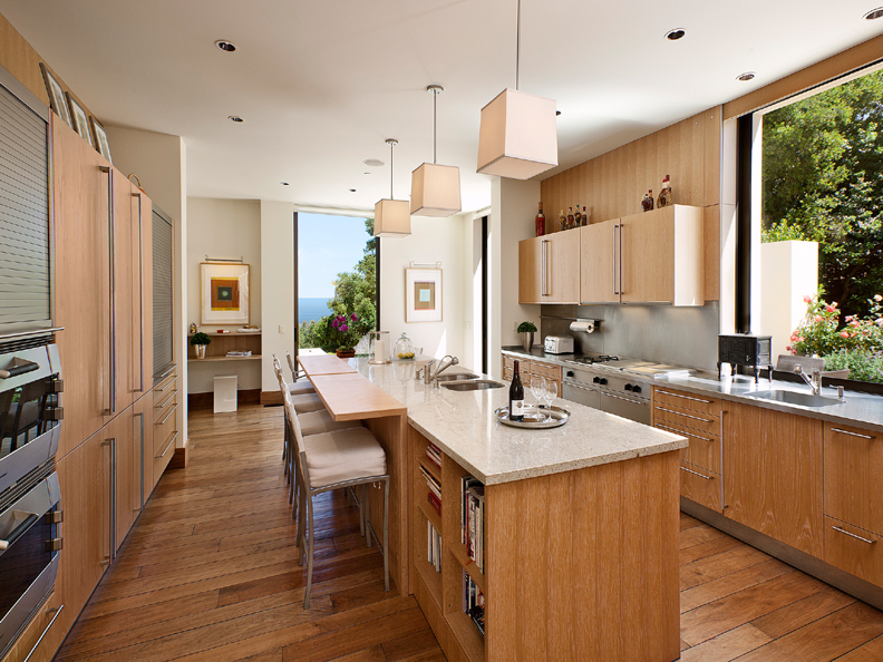 356 Woodley Road Montecito, CA 93108 - Photo 7 of 17 a kitchen with a sink stove and wooden cabinets