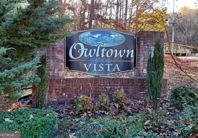 a view of street with wooden bridge