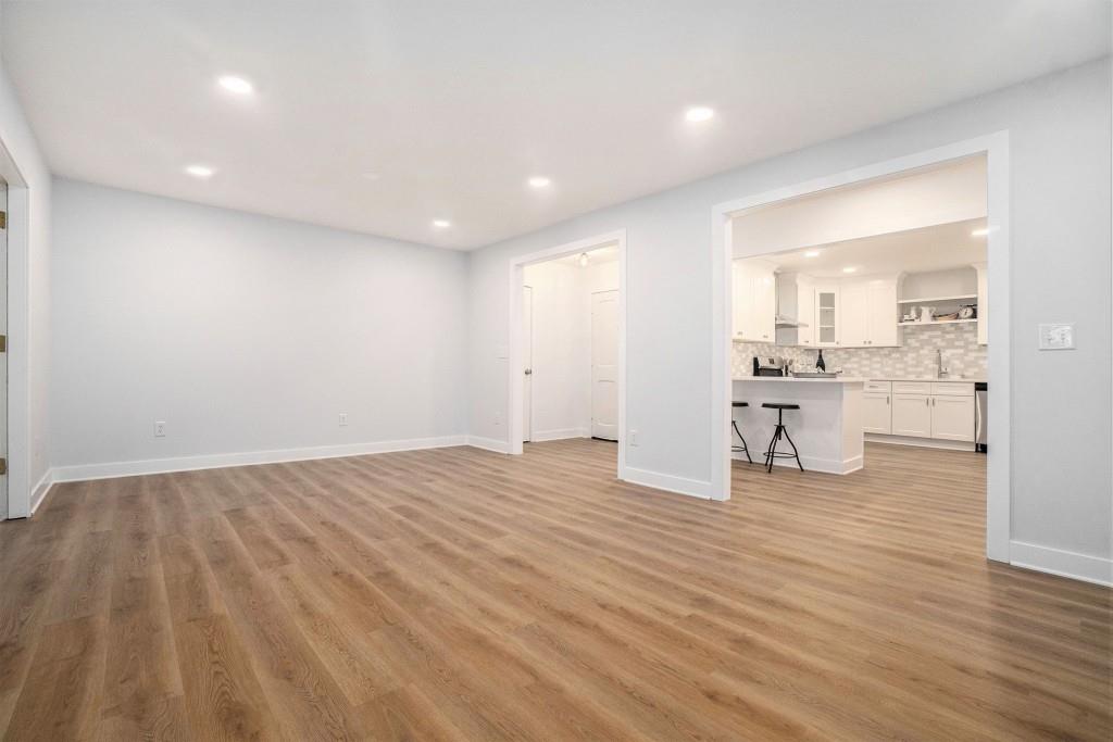 46 La Rue Place Northwest Atlanta, GA 30327 - Photo 11 of 28 a view of empty room with wooden floor