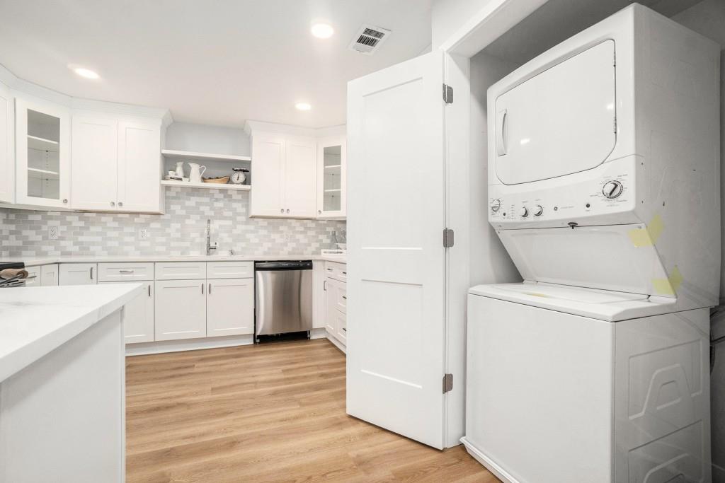 46 La Rue Place Northwest Atlanta, GA 30327 - Photo 14 of 28 a kitchen with granite countertop white cabinets and white appliances