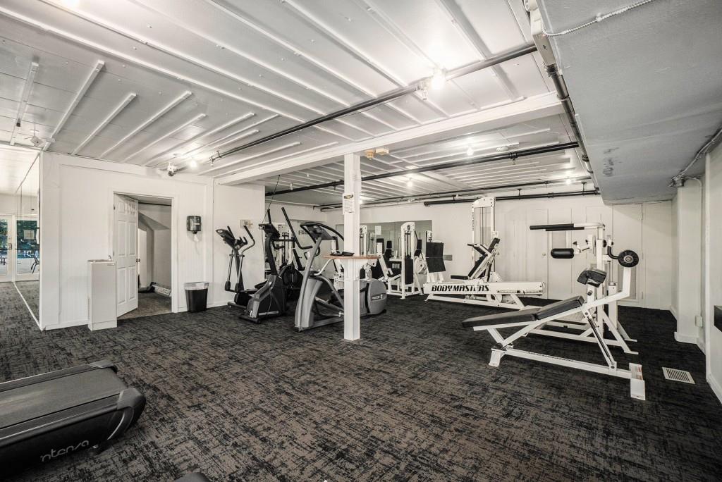 46 La Rue Place Northwest Atlanta, GA 30327 - Photo 24 of 28 a view of a room with gym equipment