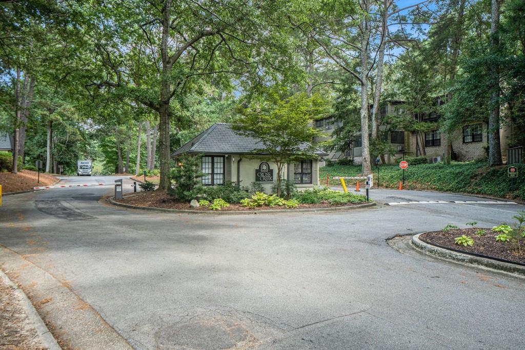 46 La Rue Place Northwest Atlanta, GA 30327 - Photo 27 of 28 a front view of a house with a yard