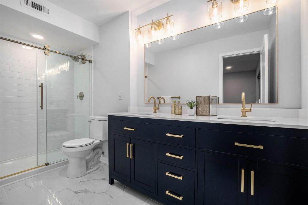 46 La Rue Place Northwest Atlanta, GA 30327 - Photo 4 of 28 a bathroom with a sink toilet and shower