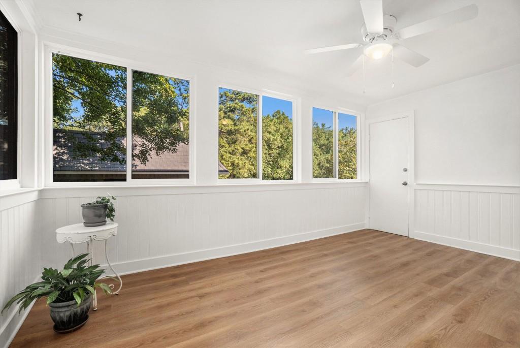 46 La Rue Place Northwest Atlanta, GA 30327 - Photo 10 of 28 a view of an empty room with wooden floor and a window