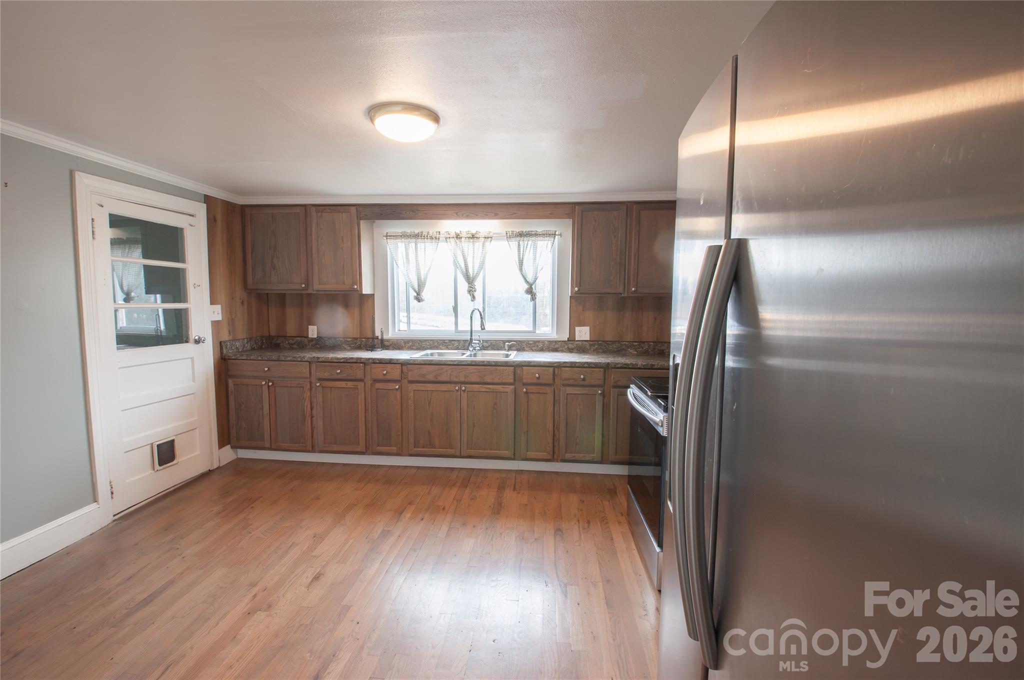127 Bristol Road Statesville, NC 28677 - Photo 3 of 10 a kitchen with kitchen island granite countertop stainless steel appliances cabinets a sink and a window