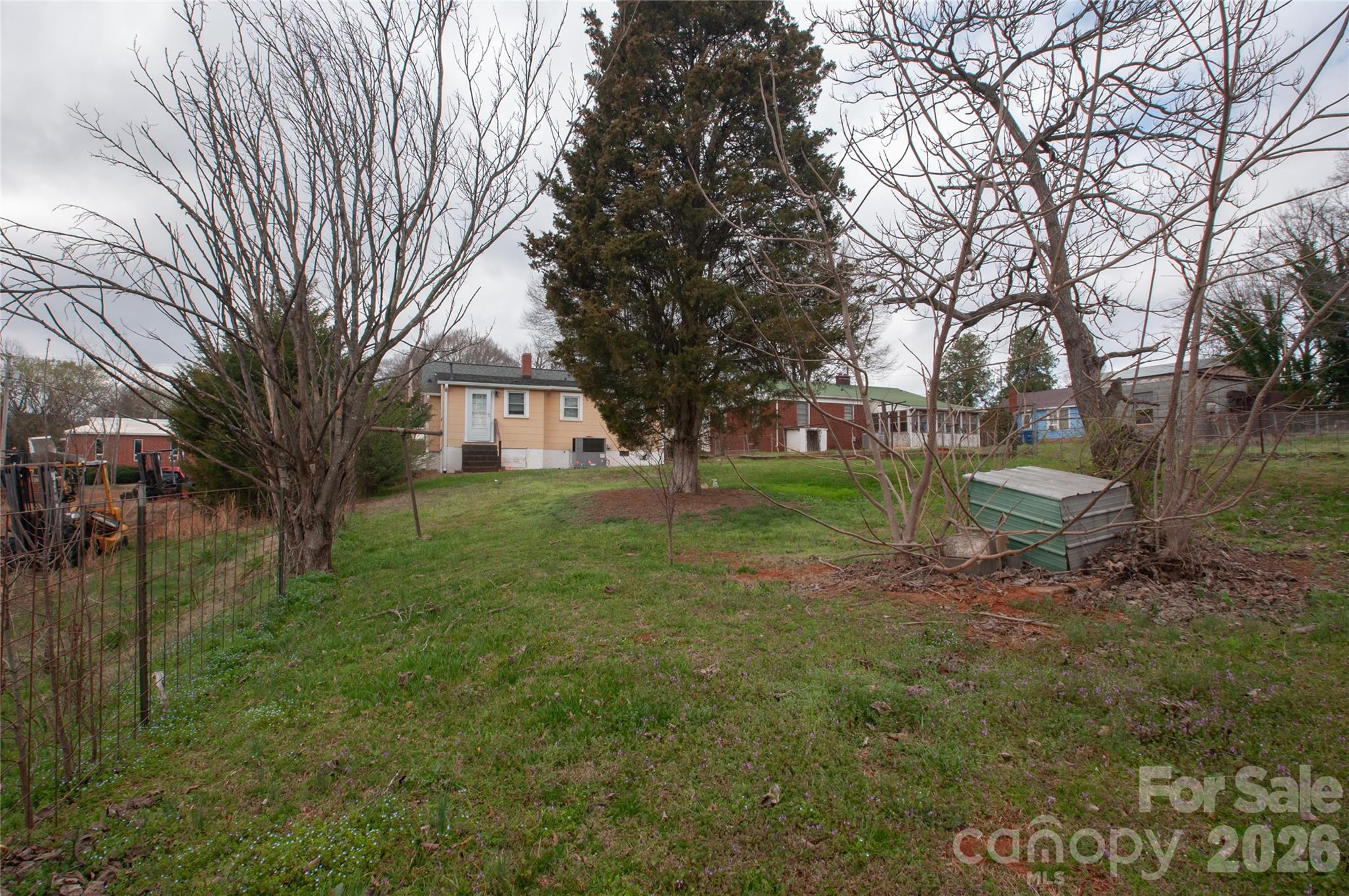 127 Bristol Road Statesville, NC 28677 - Photo 10 of 10 a backyard of a house with lots of green space and fountain