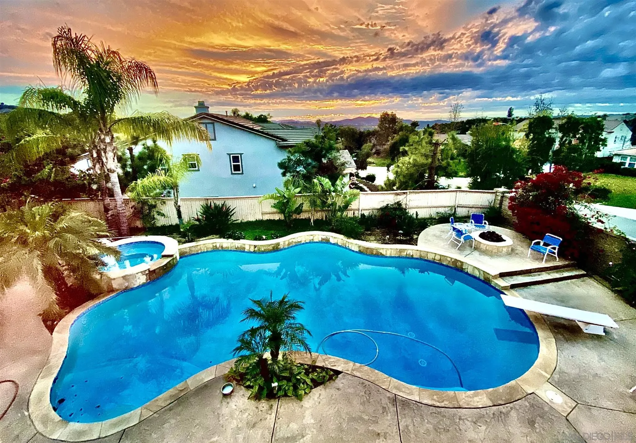 565 Hidden Trails Road Escondido, CA 92027 - Photo 12 of 52 a view of a swimming pool with a yard