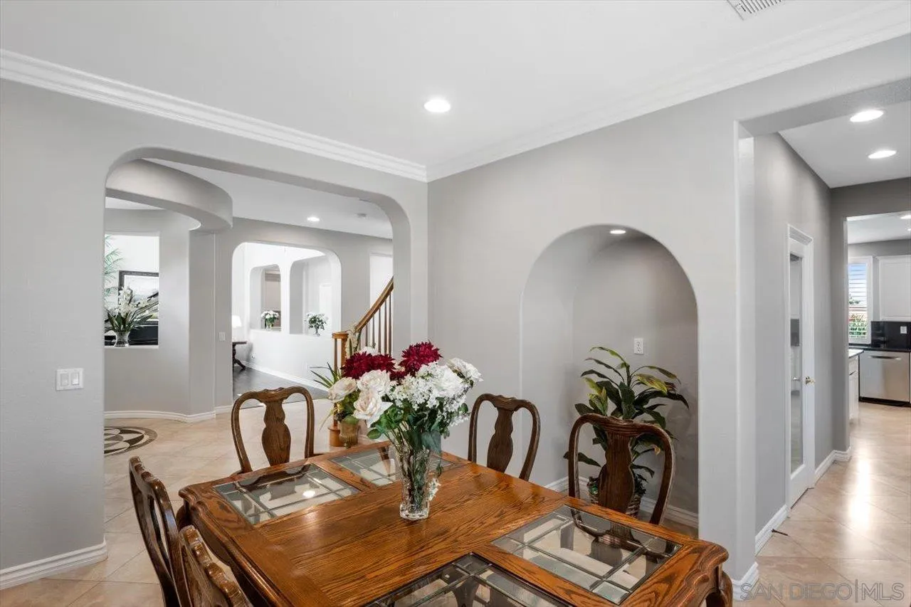 565 Hidden Trails Road Escondido, CA 92027 - Photo 16 of 52 a dining room with furniture and wooden floor