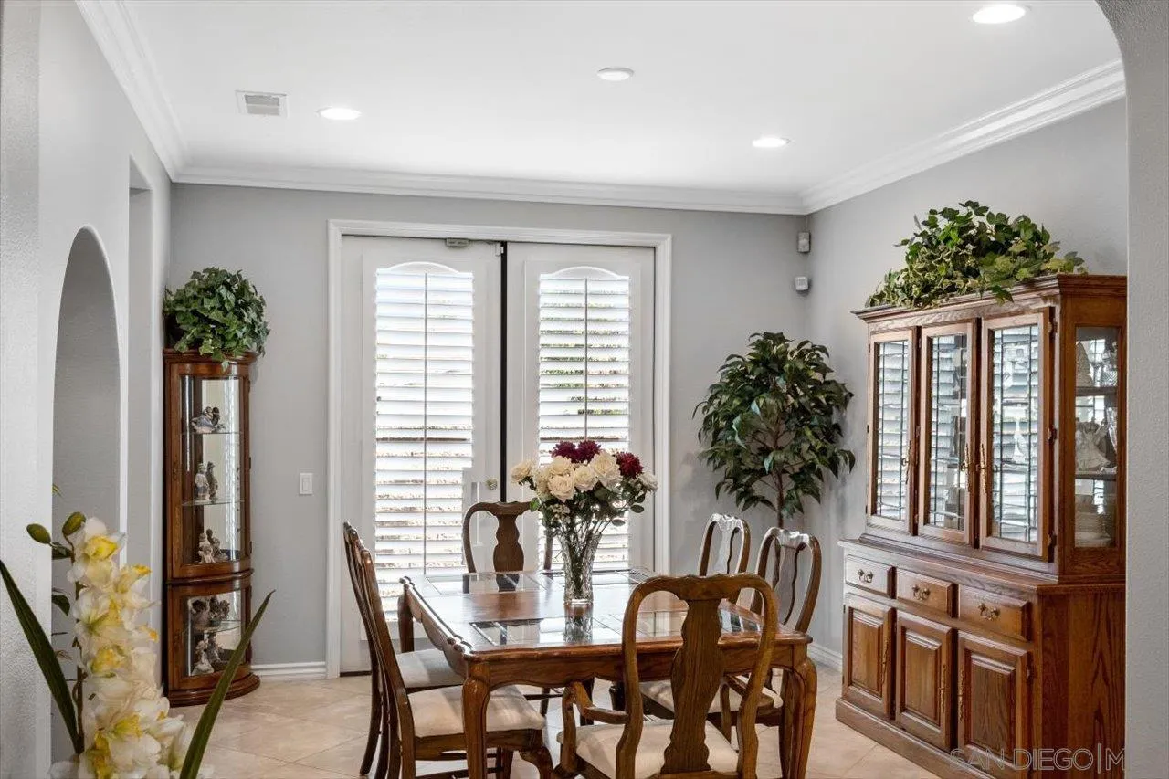 565 Hidden Trails Road Escondido, CA 92027 - Photo 17 of 52 a view of a dining room with furniture and window