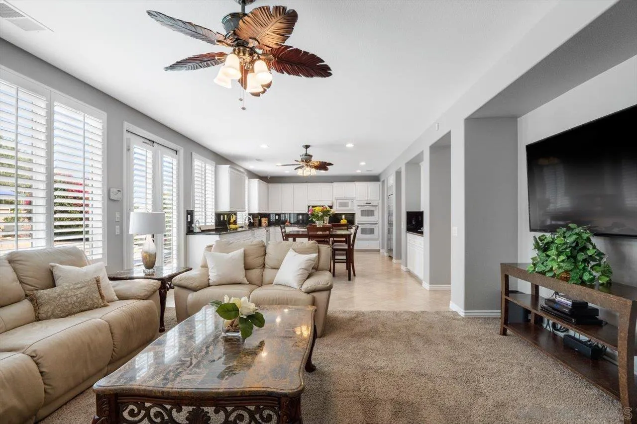 565 Hidden Trails Road Escondido, CA 92027 - Photo 21 of 52 a living room with furniture and a large window