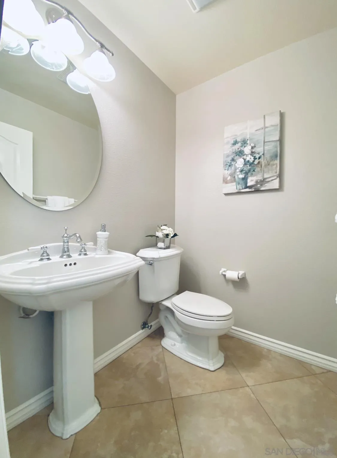 565 Hidden Trails Road Escondido, CA 92027 - Photo 22 of 52 a bathroom with a sink and mirror