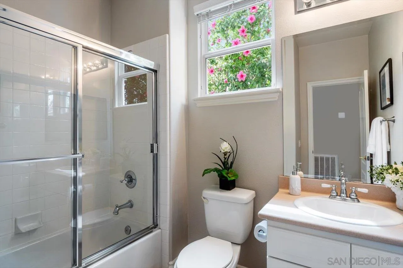 565 Hidden Trails Road Escondido, CA 92027 - Photo 25 of 52 a bathroom with a sink toilet and shower