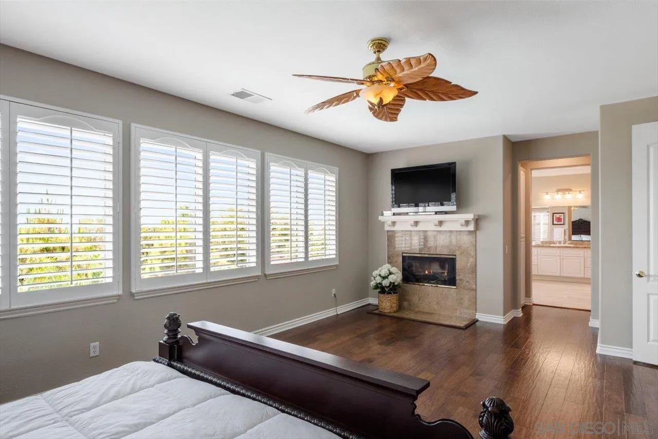 565 Hidden Trails Road Escondido, CA 92027 - Photo 28 of 52 a living room with furniture and a fireplace