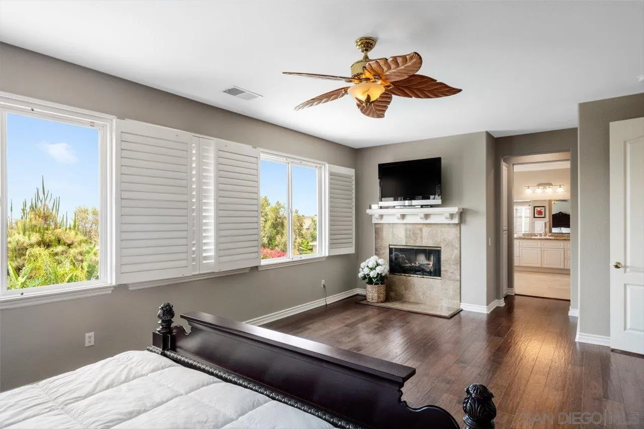 565 Hidden Trails Road Escondido, CA 92027 - Photo 29 of 52 a living room with furniture and a fireplace