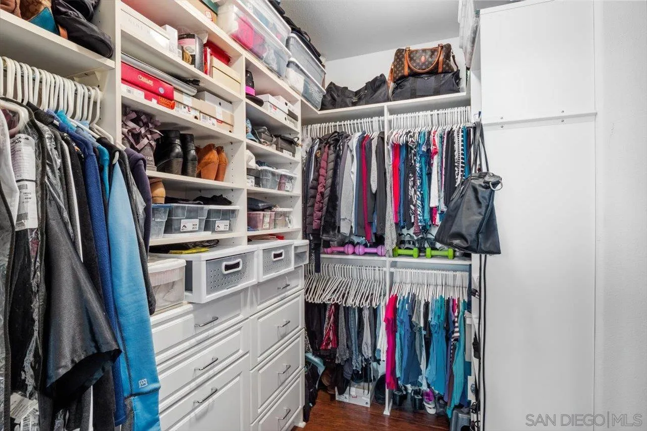 565 Hidden Trails Road Escondido, CA 92027 - Photo 33 of 52 a view of walk in closet with clothes