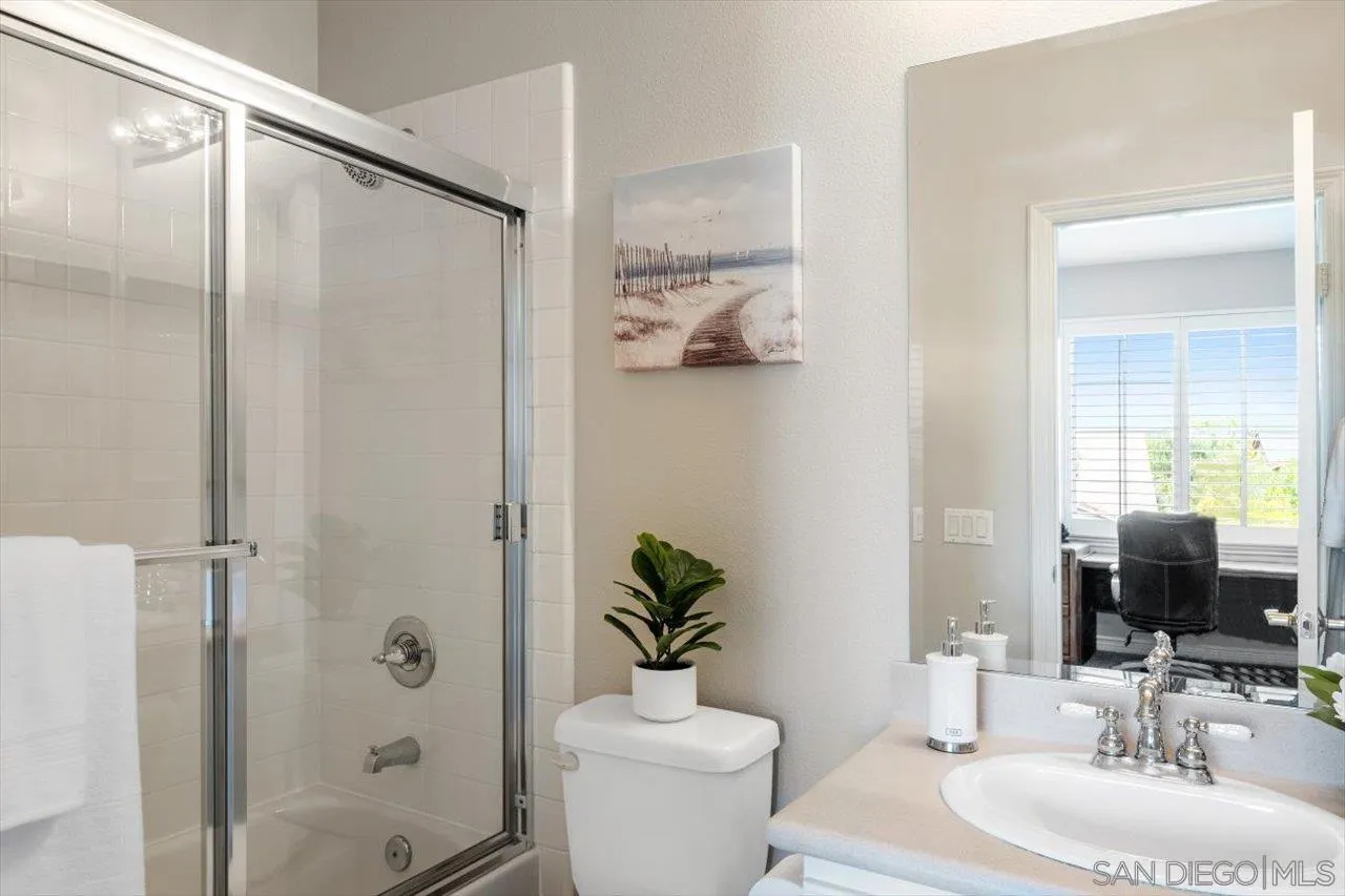 565 Hidden Trails Road Escondido, CA 92027 - Photo 35 of 52 a bathroom with a sink toilet and shower