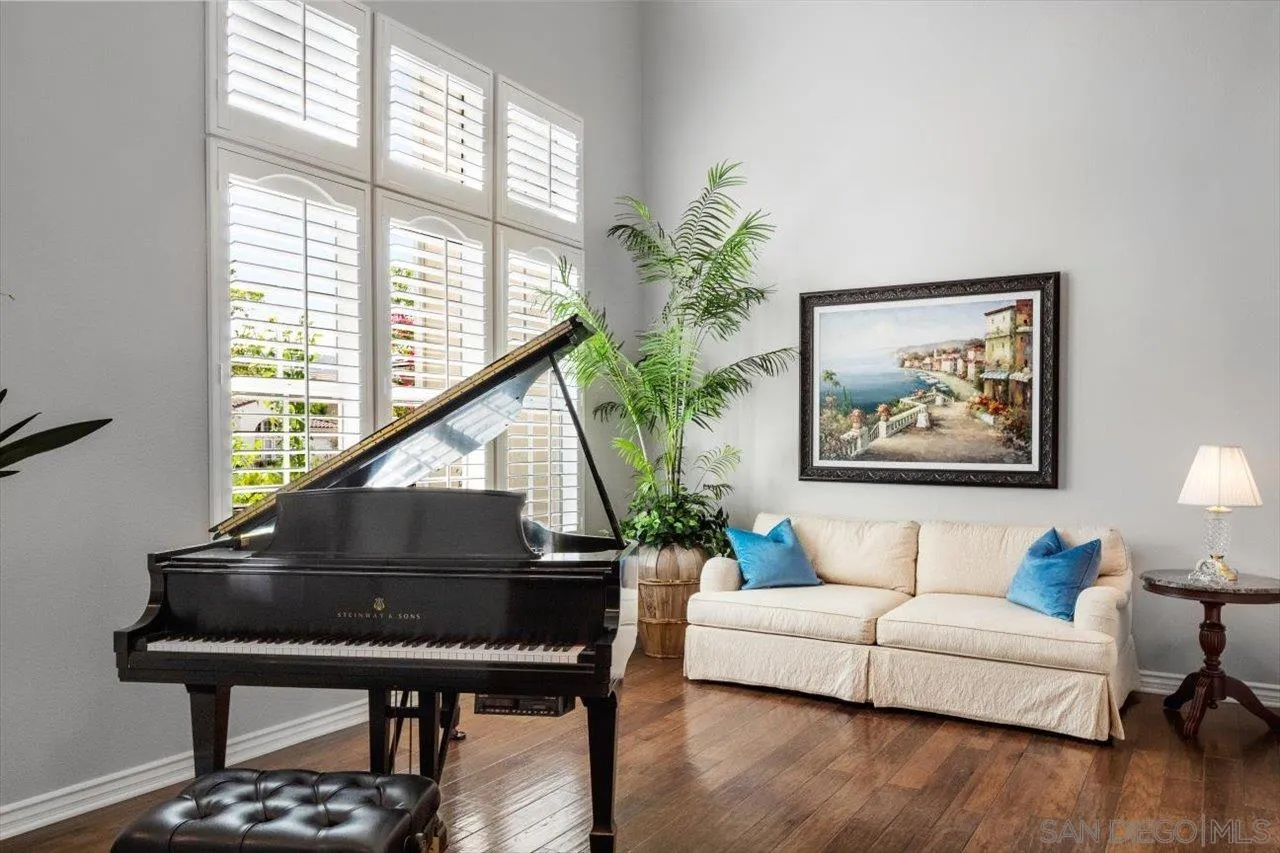 565 Hidden Trails Road Escondido, CA 92027 - Photo 4 of 52 a living room with furniture and a potted plant