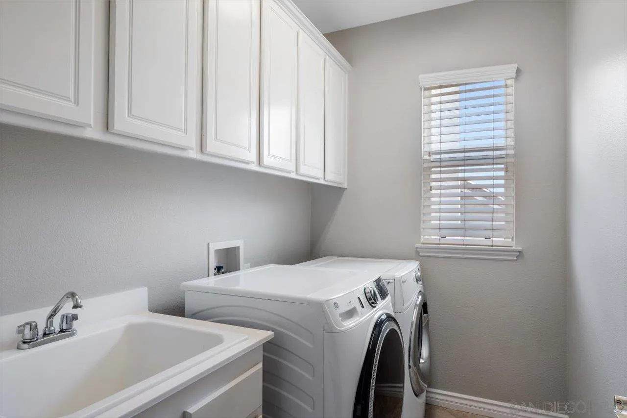 565 Hidden Trails Road Escondido, CA 92027 - Photo 41 of 52 a utility room with dryer and washer