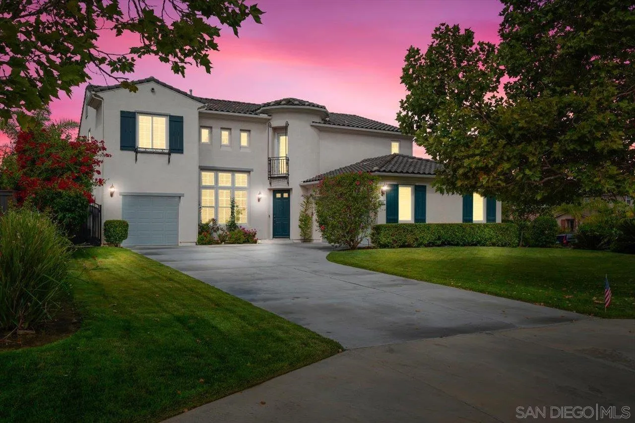 565 Hidden Trails Road Escondido, CA 92027 - Photo 44 of 52 a front view of a house with a yard and garage