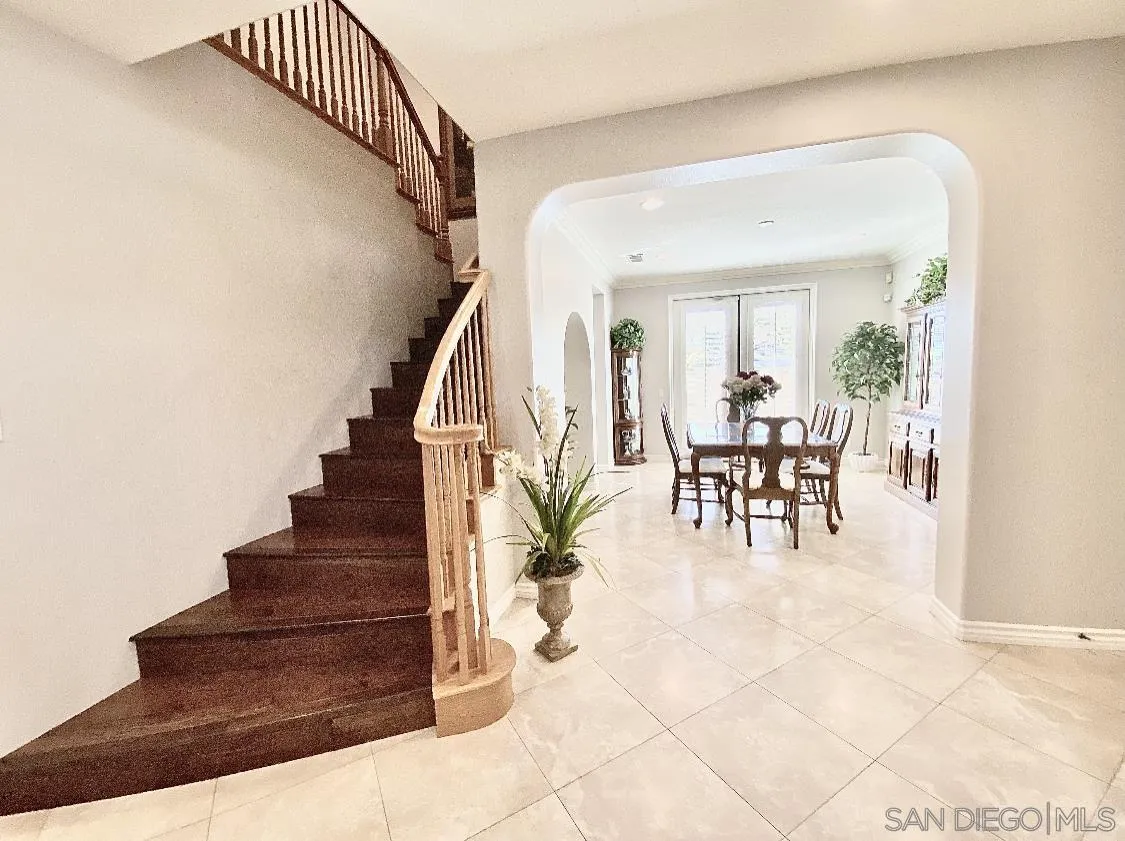 565 Hidden Trails Road Escondido, CA 92027 - Photo 5 of 52 a view of entryway and dining room with furniture