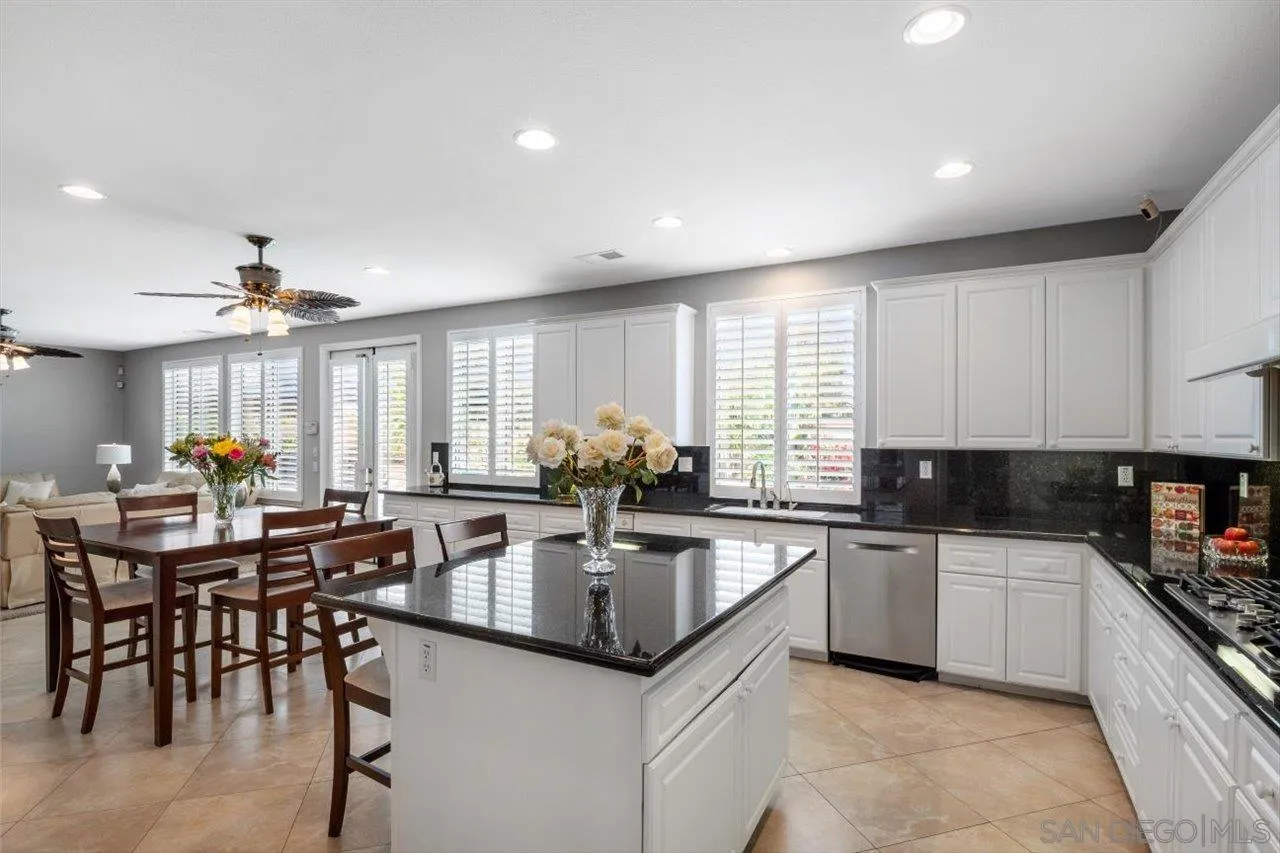 565 Hidden Trails Road Escondido, CA 92027 - Photo 6 of 52 a kitchen with lots of counter top space and appliances