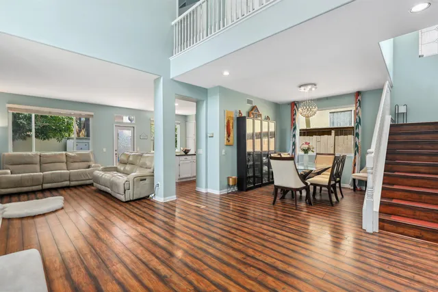 a view of a livingroom with furniture and wooden floor