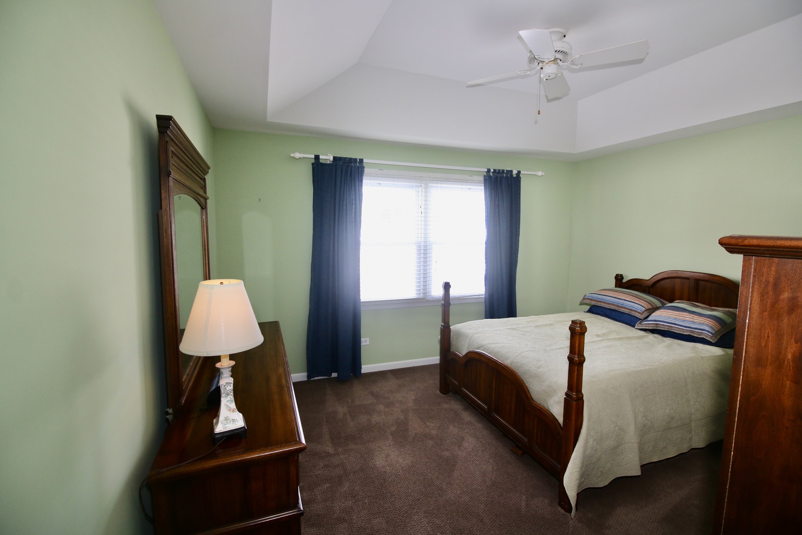 19213 Weber Road Mokena, IL 60448 - Photo 17 of 36 a bed room with a bed window and a mirror