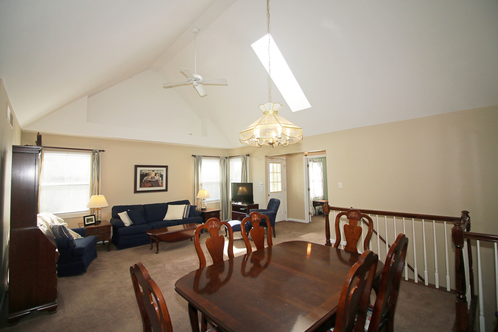 19213 Weber Road Mokena, IL 60448 - Photo 7 of 36 a view of a dining room and livingroom with furniture wooden floor a chandelier