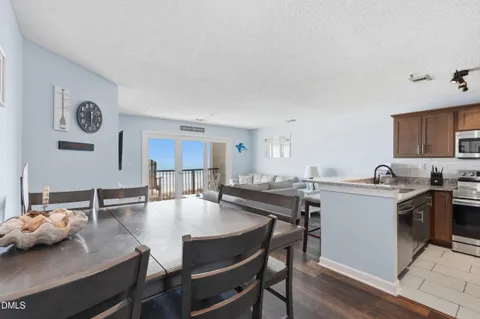 a view of a dining room with furniture and a table
