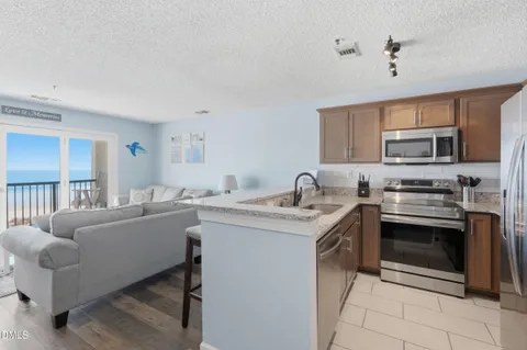 a kitchen with a table and chairs in it