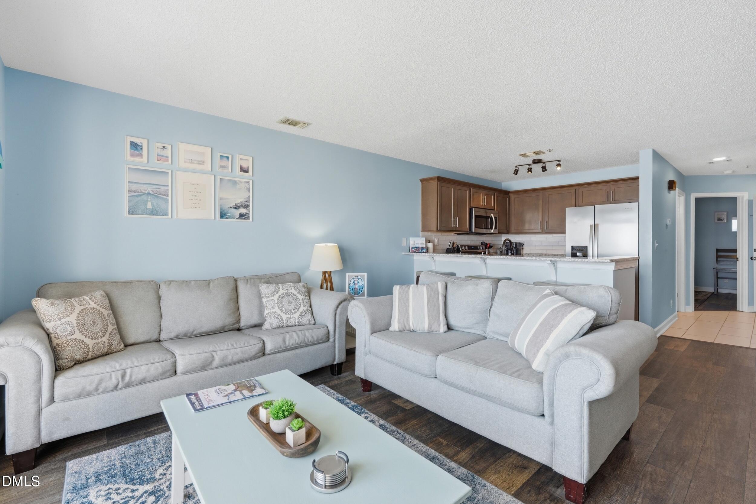 790 New River Inlet Road, Unit 114A North Topsail Beach, NC 28460 - Photo 20 of 46 a living room with furniture and a couch