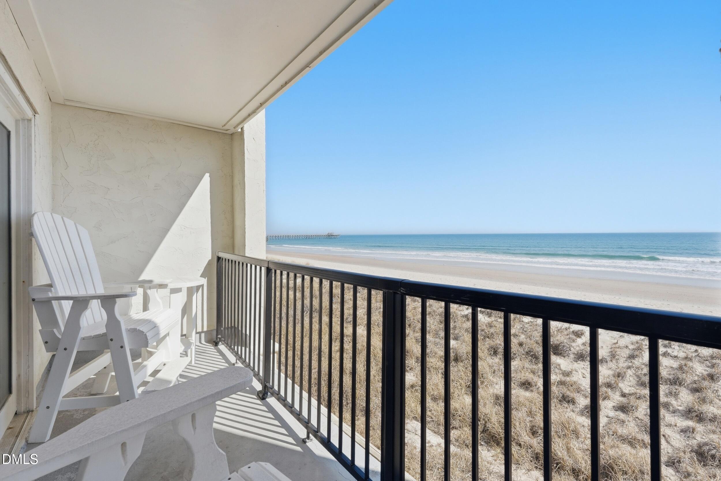 790 New River Inlet Road, Unit 114A North Topsail Beach, NC 28460 - Photo 25 of 46 a view of a balcony with furniture