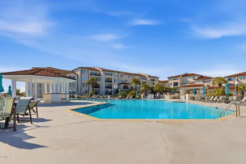a view of a swimming pool with sitting area