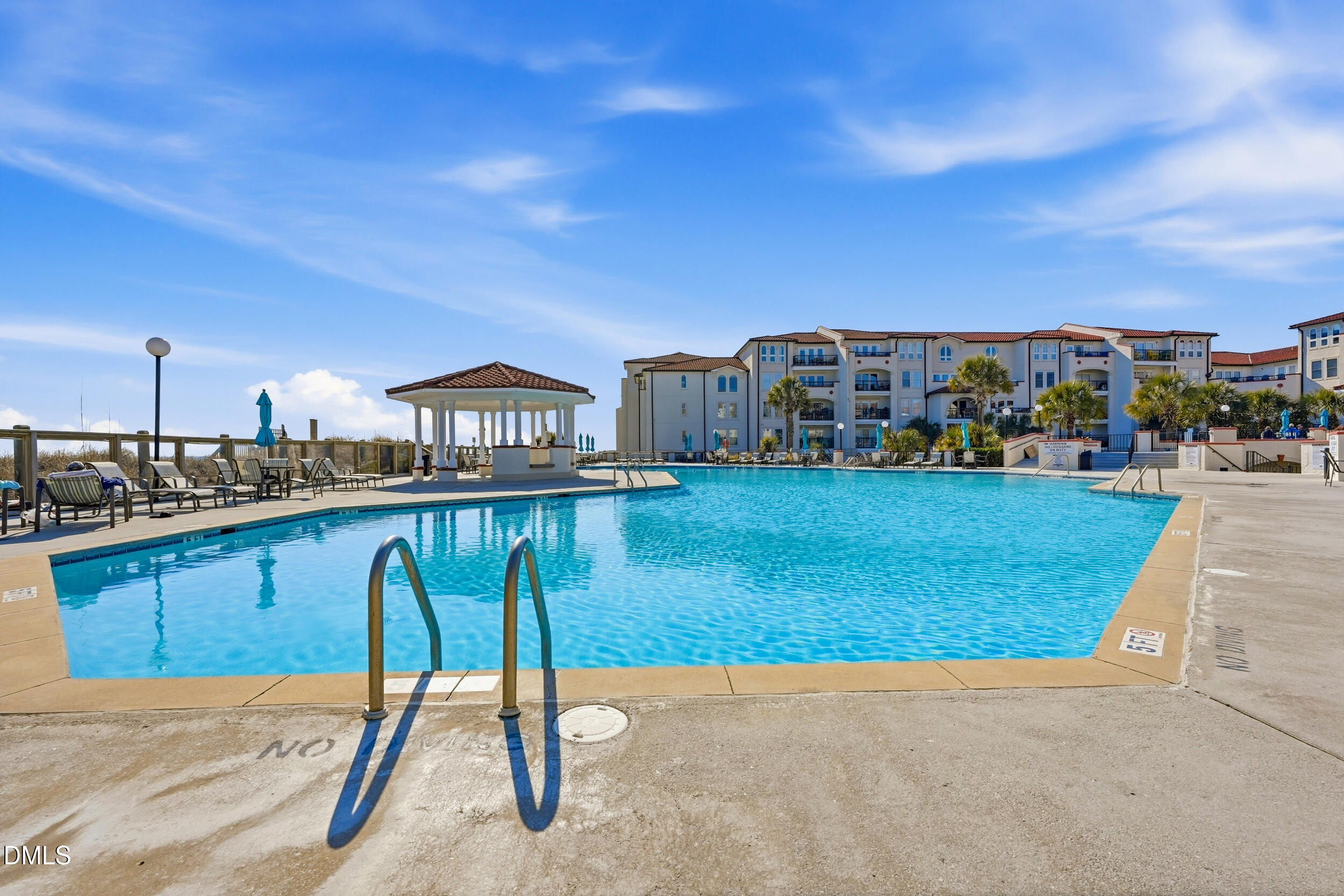 790 New River Inlet Road, Unit 114A North Topsail Beach, NC 28460 - Photo 38 of 46 a view of a swimming pool with a chairs