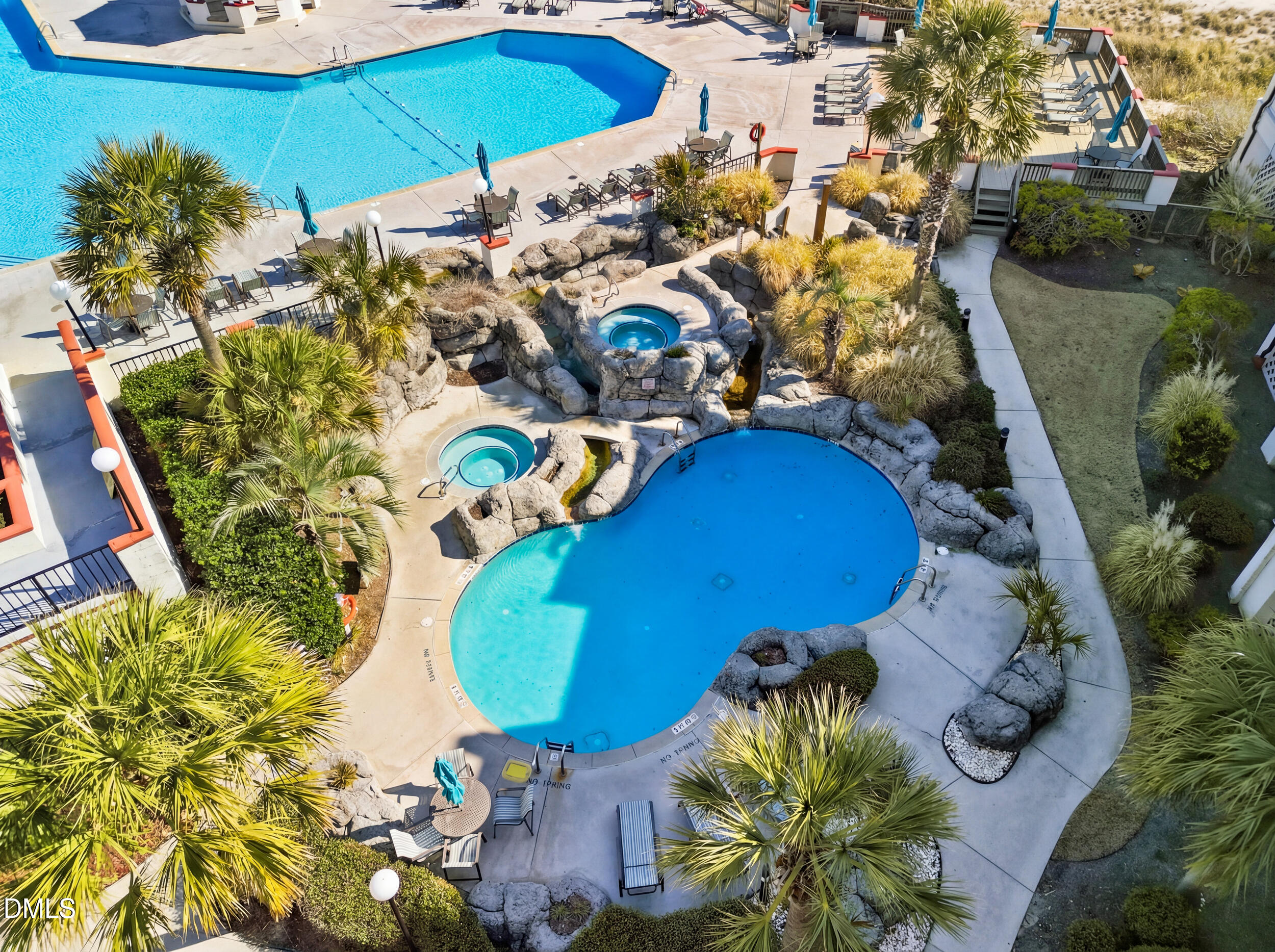 790 New River Inlet Road, Unit 114A North Topsail Beach, NC 28460 - Photo 41 of 46 an aerial view of a swimming pool with yard and outdoor seating