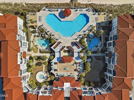 an aerial view of a house with a swimming pool