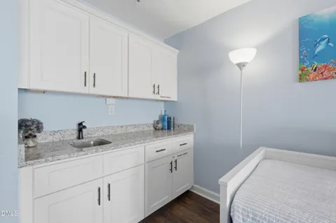 a large white bed in a white room