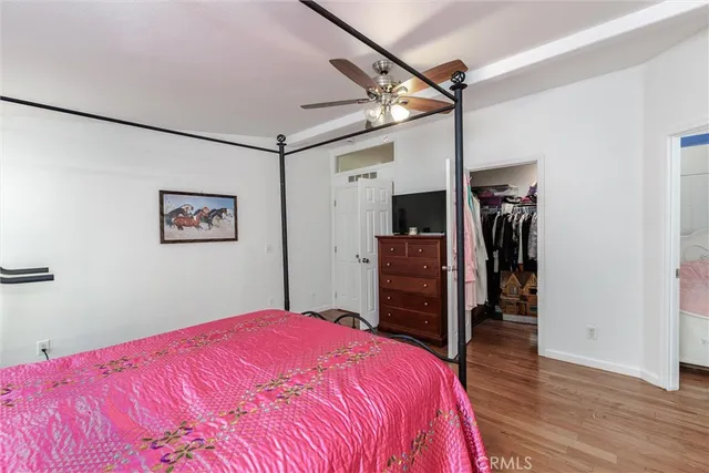 a bedroom with a large bed and a closet