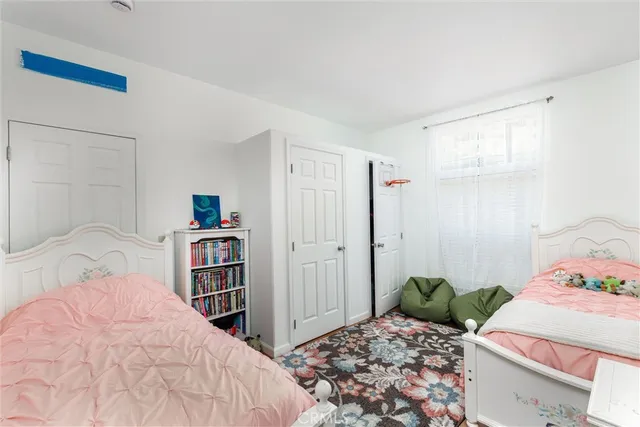 a bedroom with a bed and a closet