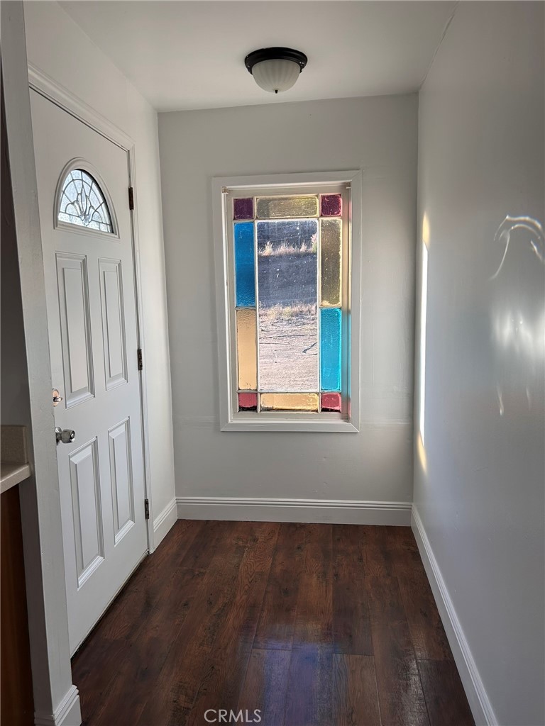 4905 Huasna Road Arroyo Grande, CA 93420 - Photo 31 of 59 an empty room with wooden floor closet and windows