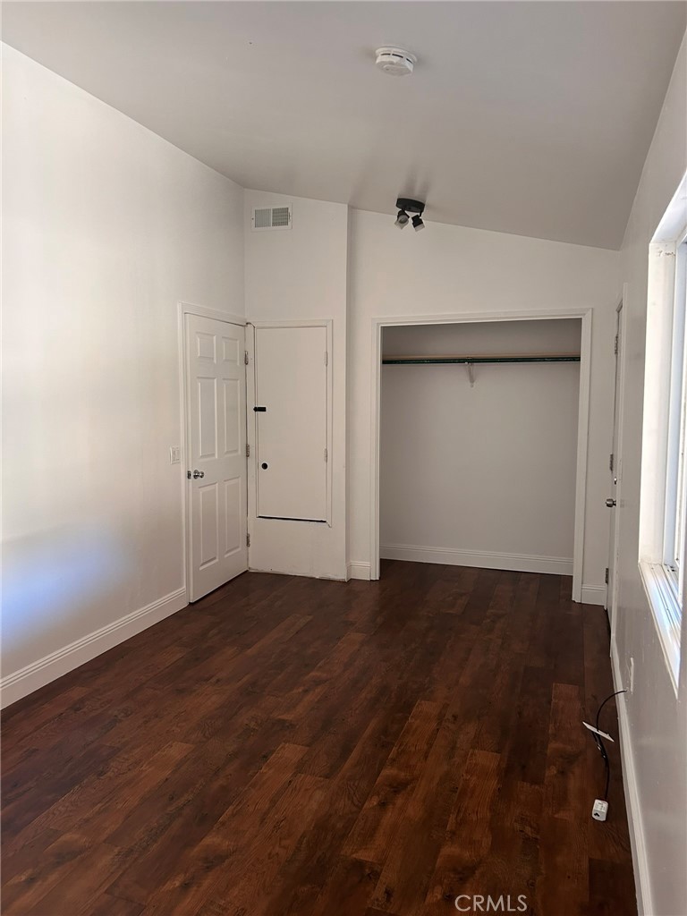 4905 Huasna Road Arroyo Grande, CA 93420 - Photo 36 of 59 an empty room with wooden floor and windows