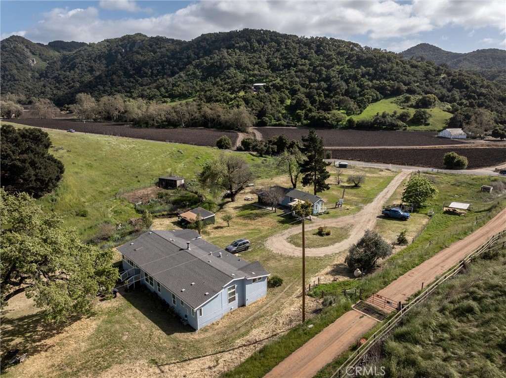 4905 Huasna Road Arroyo Grande, CA 93420 - Photo 38 of 59 a view of a lake with a mountain in the background