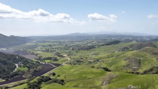 a view of a town with mountains in the background