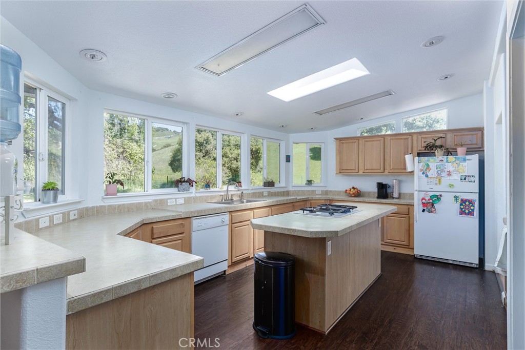 4905 Huasna Road Arroyo Grande, CA 93420 - Photo 8 of 59 a kitchen with a sink stove and cabinets