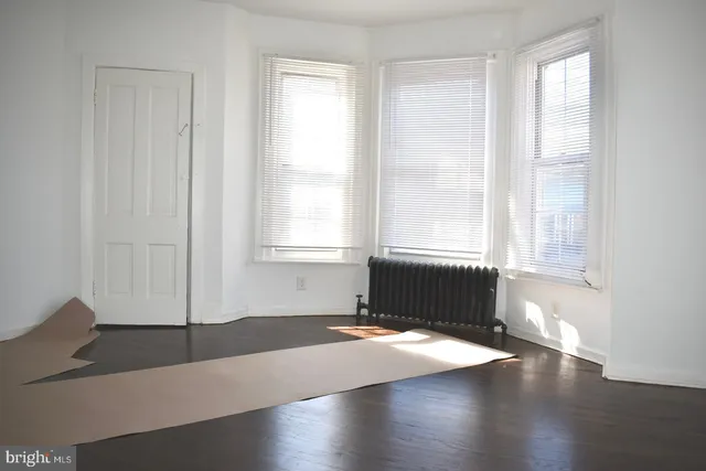 a view of a livingroom with wooden floor