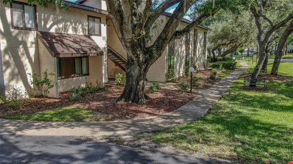 a view of a house with a yard