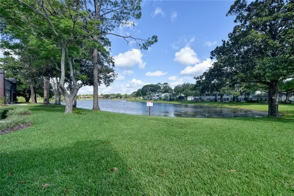 an aerial view of a house with a lake view