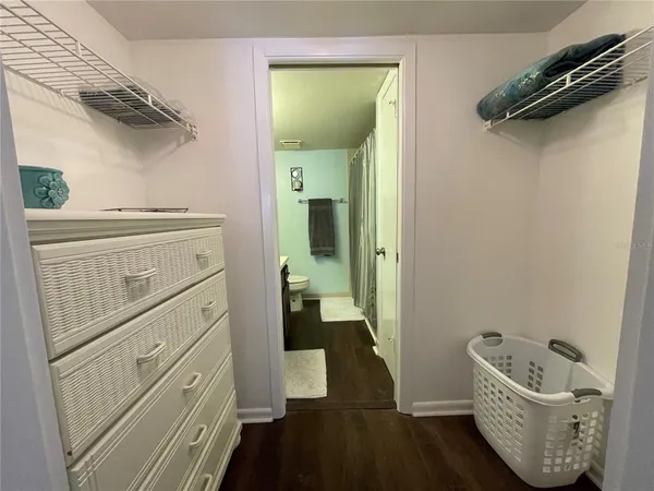 a kitchen with a refrigerator and cabinets