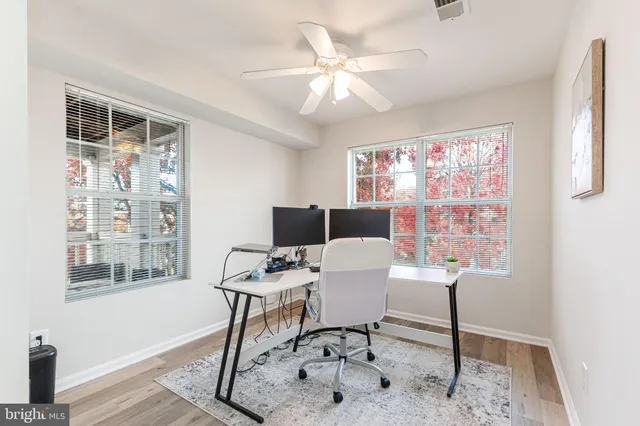 a workspace with furniture and a window